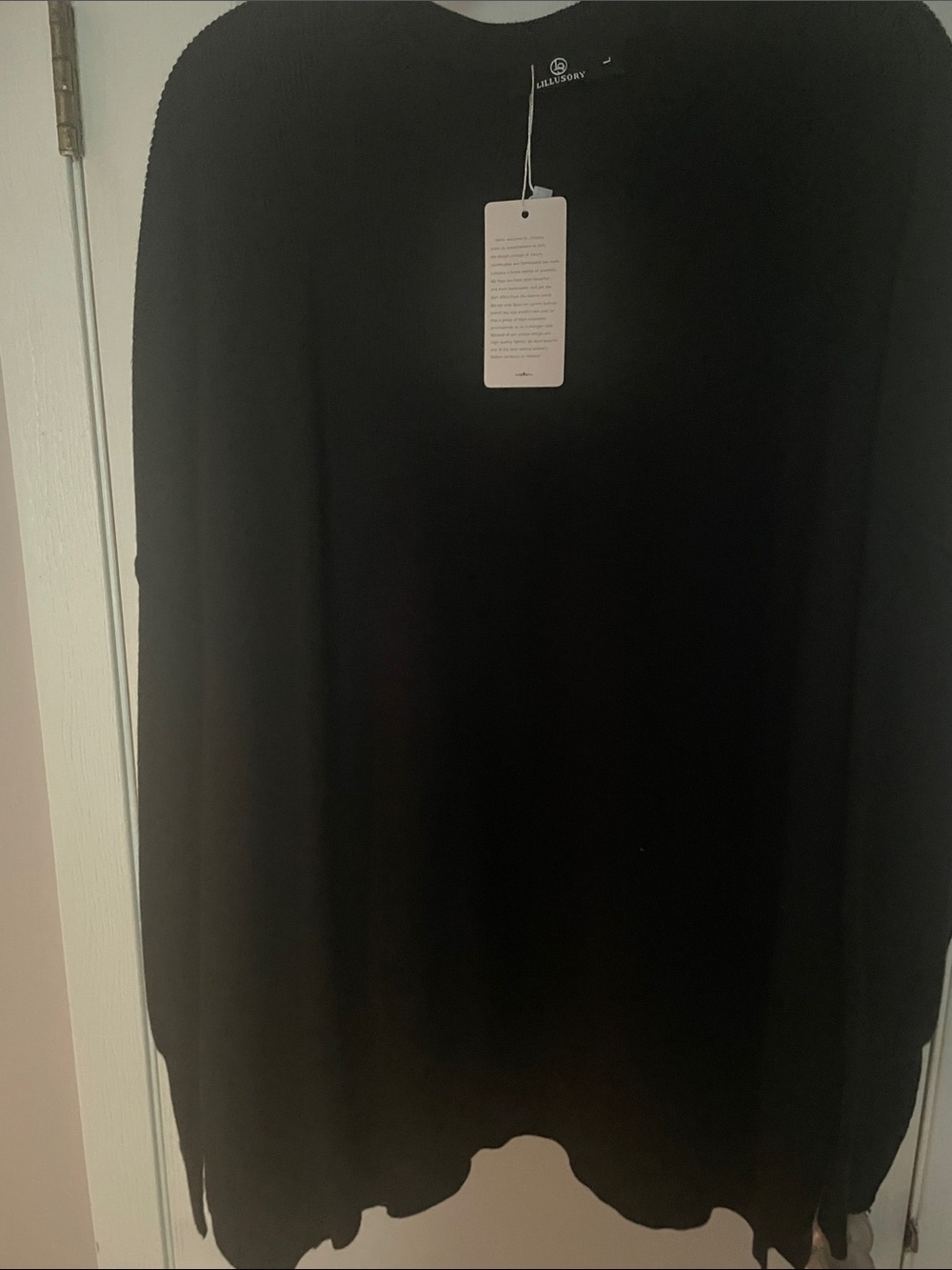 Ladies size large new with tags black sweater with slits